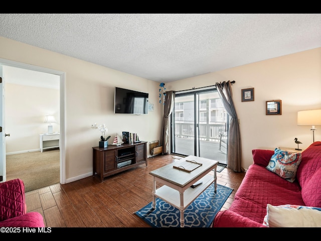1013 Carolina Beach Ave N Unit 1F, Carolina Beach, NC 28428 - living room featuring wood finished floors, a textured ceiling, and baseboards