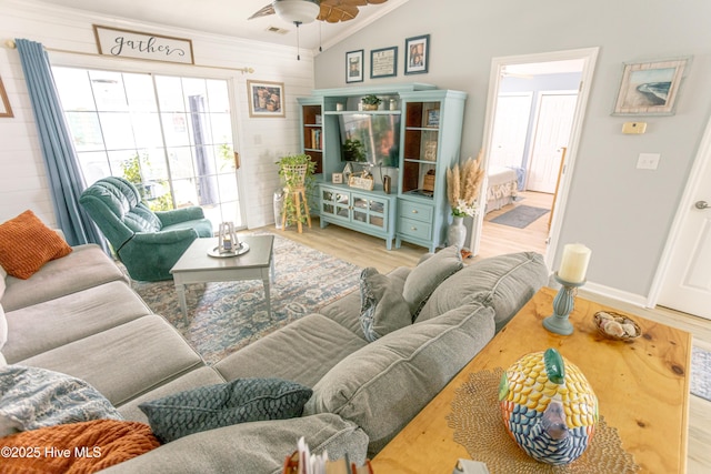 132 Charlton Rd, Hubert, NC 28539 - living room featuring lofted ceiling, wood finished floors, a ceiling fan, ornamental molding, and wood walls