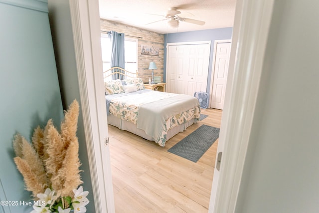 132 Charlton Rd, Hubert, NC 28539 - bedroom with multiple closets, wood finished floors, and a ceiling fan