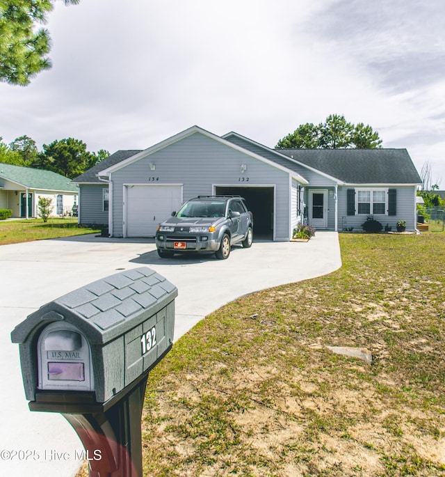 132 Charlton Rd, Hubert, NC 28539 - ranch-style house featuring concrete driveway, a garage, and a front yard