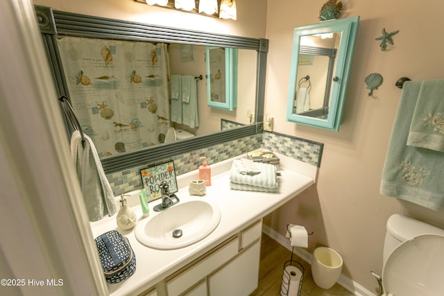 132 Charlton Rd, Hubert, NC 28539 - full bathroom with toilet, decorative backsplash, vanity, a shower with curtain, and baseboards