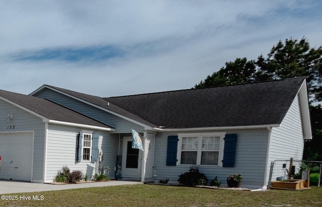 132 Charlton Rd, Hubert, NC 28539 - ranch-style house with a garage, a shingled roof, and a front lawn