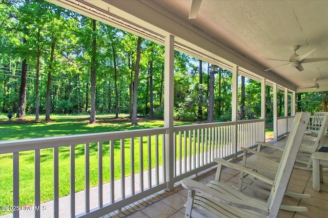 2 Pinewood Dr, Calabash, NC 28467 - wooden deck featuring a ceiling fan and a yard