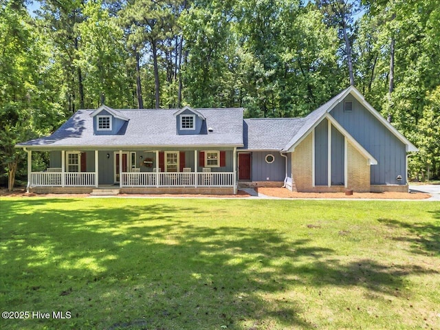 2 Pinewood Dr, Calabash, NC 28467 - view of front of home with covered porch and a front yard