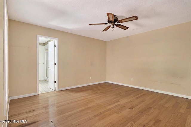 2 Pinewood Dr, Calabash, NC 28467 - empty room featuring ceiling fan, light wood-style floors, baseboards, and a textured ceiling