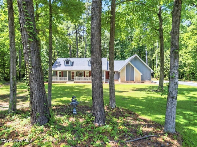 2 Pinewood Dr, Calabash, NC 28467 - view of front of property with a porch and a front yard