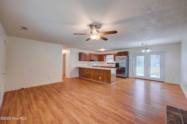 4448 Jamey Ct, Wilmington, NC 28405 - kitchen with stainless steel refrigerator with ice dispenser, a peninsula, open floor plan, ceiling fan, and light wood-type flooring