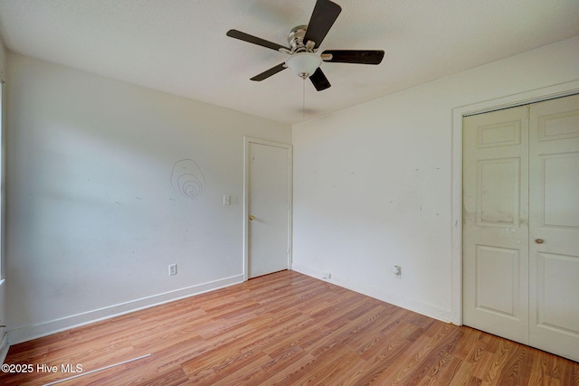 4448 Jamey Ct, Wilmington, NC 28405 - unfurnished bedroom featuring light wood-type flooring, baseboards, a closet, and ceiling fan
