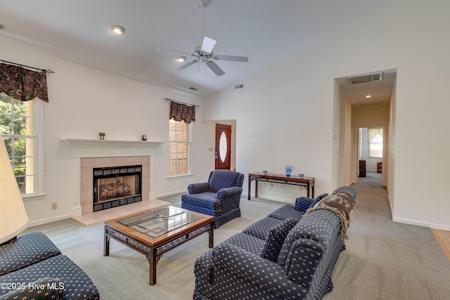 315 Thomas Pl, Washington, NC 27889 - carpeted living room featuring healthy amount of natural light, baseboards, a tiled fireplace, and vaulted ceiling