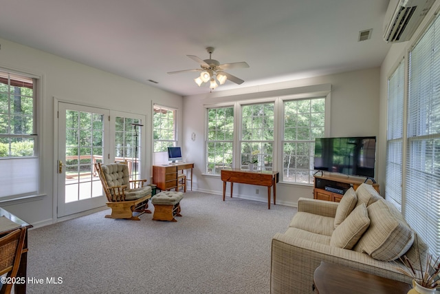 315 Thomas Pl, Washington, NC 27889 - living room with a wall mounted air conditioner, carpet, baseboards, and a ceiling fan