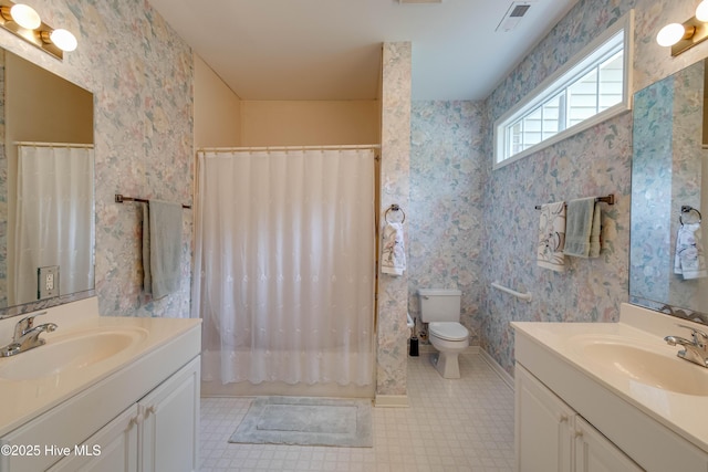 315 Thomas Pl, Washington, NC 27889 - bathroom with toilet, two vanities, tile patterned floors, and shower / bath combo with shower curtain