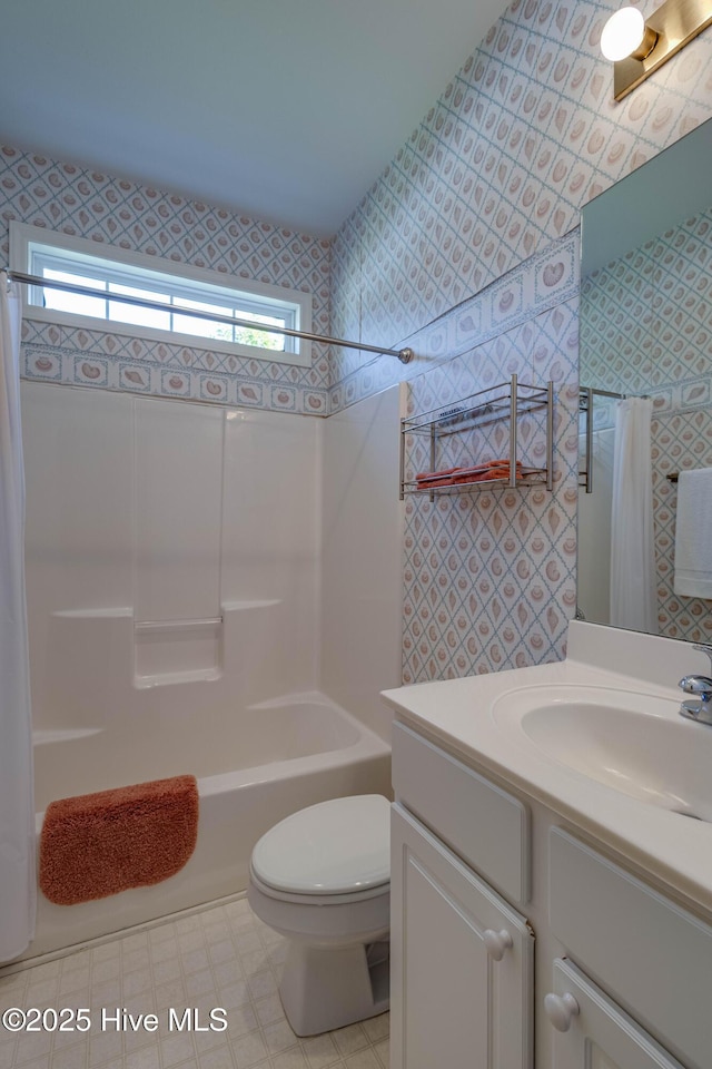 315 Thomas Pl, Washington, NC 27889 - bathroom featuring wallpapered walls, shower / bathtub combination with curtain, vanity, and toilet