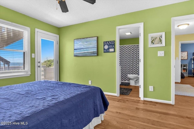 939 Ocean Blvd W, Holden Beach, NC 28462 - bedroom featuring wood finished floors, baseboards, access to outside, and ensuite bathroom