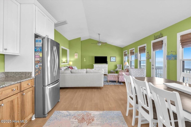 939 Ocean Blvd W, Holden Beach, NC 28462 - kitchen with freestanding refrigerator, ceiling fan, light wood-style flooring, lofted ceiling, and white cabinets