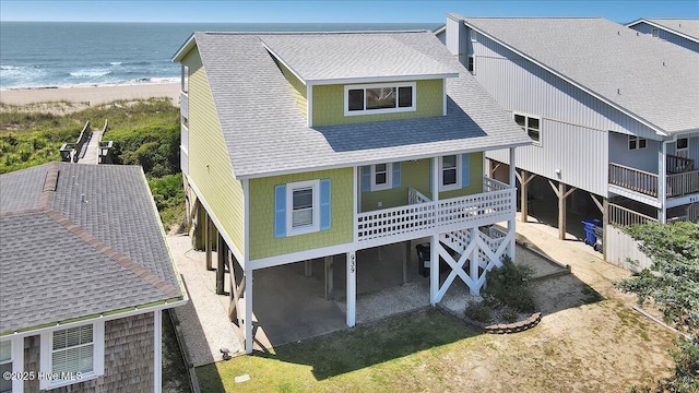 939 Ocean Blvd W, Holden Beach, NC 28462 - rear view of property featuring roof with shingles, view of water and beach, and a patio area