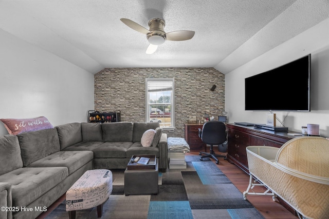 119 Cobblestone Trl, Jacksonville, NC 28546 - living area featuring ceiling fan, vaulted ceiling, wood finished floors, and a textured ceiling