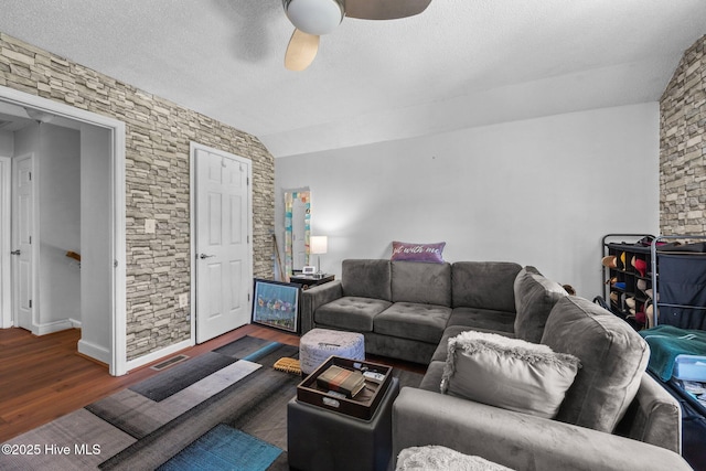 119 Cobblestone Trl, Jacksonville, NC 28546 - living room with ceiling fan, wood finished floors, vaulted ceiling, and a textured ceiling