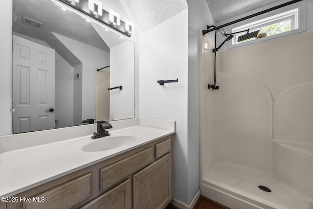 119 Cobblestone Trl, Jacksonville, NC 28546 - full bathroom with a shower, vanity, and a textured ceiling