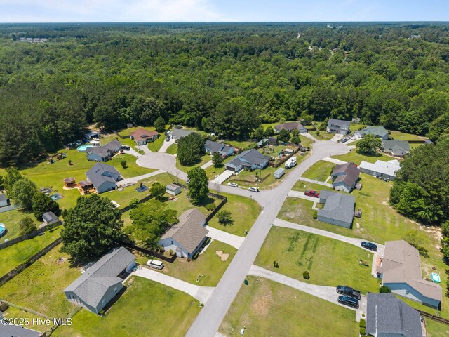 119 Cobblestone Trl, Jacksonville, NC 28546 - aerial view of property and surrounding area featuring a heavily wooded area and nearby suburban area