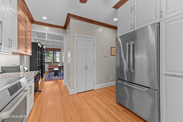 1404 Tosto Cir Apt 5, Oriental, NC 28571 - kitchen with stainless steel refrigerator, light wood-type flooring, crown molding, stove, and white cabinets
