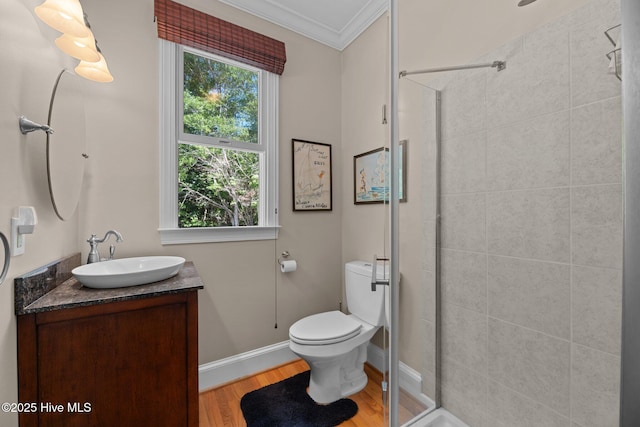 1404 Tosto Cir Apt 5, Oriental, NC 28571 - full bathroom with crown molding, vanity, a tile shower, wood finished floors, and toilet