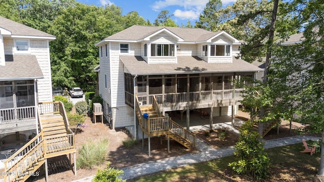 1404 Tosto Cir Apt 5, Oriental, NC 28571 - rear view of house with stairway, a sunroom, and roof with shingles