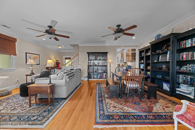 1404 Tosto Cir Apt 5, Oriental, NC 28571 - dining room with ceiling fan, wood finished floors, stairway, plenty of natural light, and ornamental molding