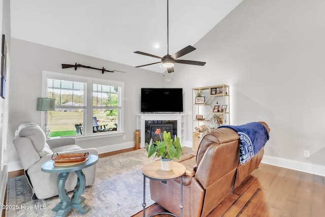 115 Norman Cir, Aberdeen, NC 28315 - living room featuring baseboards, ceiling fan, wood finished floors, and a glass covered fireplace