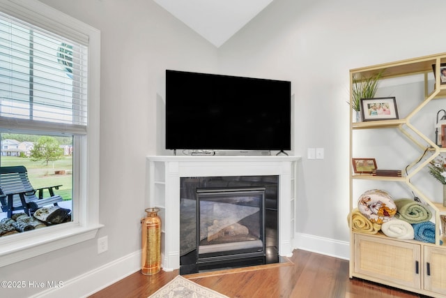 115 Norman Cir, Aberdeen, NC 28315 - detailed view of a fireplace with flush hearth, wood finished floors, and baseboards
