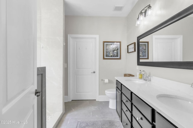 115 Norman Cir, Aberdeen, NC 28315 - bathroom featuring double vanity, toilet, a tile shower, and baseboards
