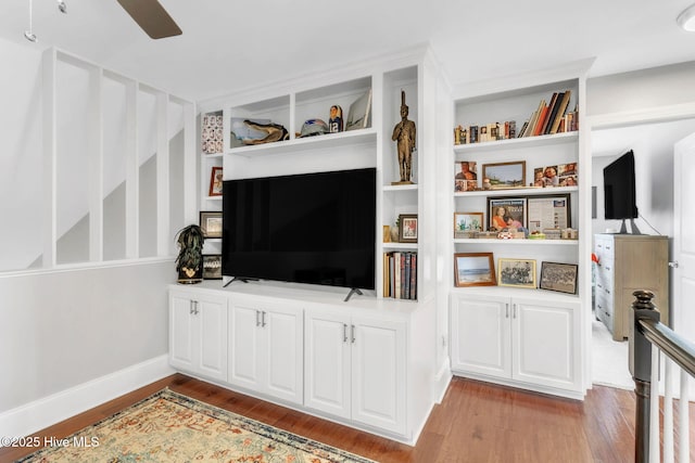 115 Norman Cir, Aberdeen, NC 28315 - living area featuring light wood-style floors, ceiling fan, built in features, and baseboards