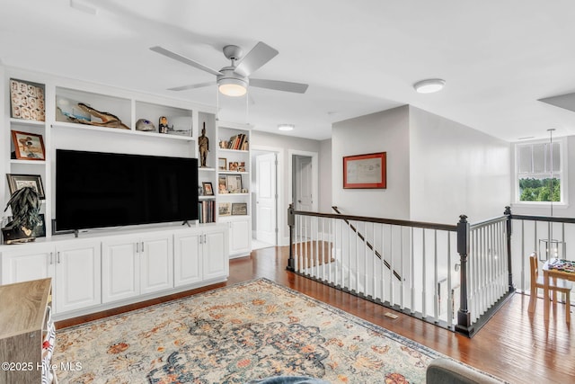 115 Norman Cir, Aberdeen, NC 28315 - living area with wood finished floors, a ceiling fan, and built in shelves