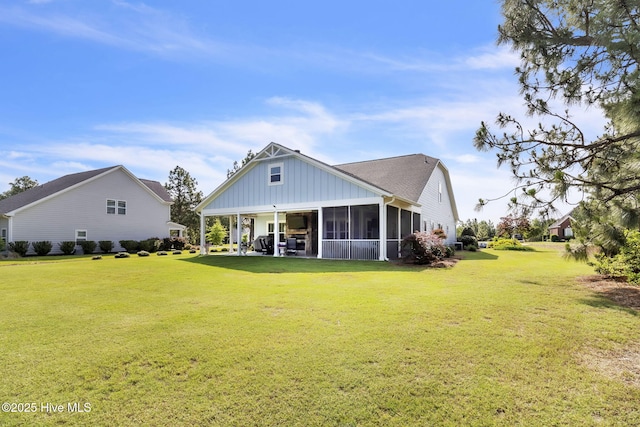 115 Norman Cir, Aberdeen, NC 28315 - rear view of property featuring a lawn, a sunroom, and board and batten siding