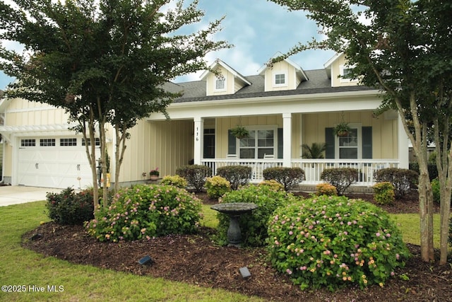 116 Helmsman Dr, Wilmington, NC 28412 - view of front of home with covered porch, board and batten siding, and an attached garage