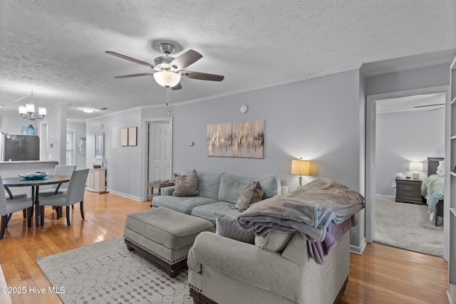 1825 Savannah Ct Unit D3, Wilmington, NC 28403 - living area with ceiling fan, light wood-style floors, a textured ceiling, ornamental molding, and baseboards