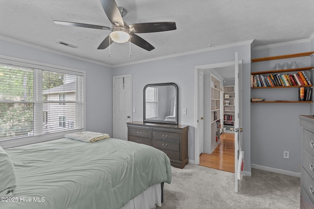 1825 Savannah Ct Unit D3, Wilmington, NC 28403 - bedroom featuring light carpet, a textured ceiling, a ceiling fan, baseboards, and ornamental molding