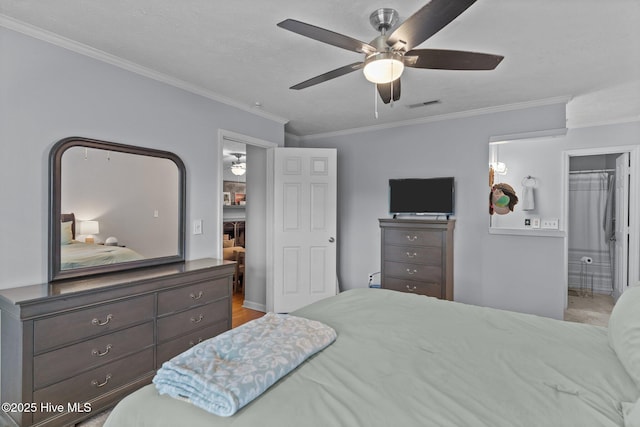 1825 Savannah Ct Unit D3, Wilmington, NC 28403 - bedroom featuring crown molding, ensuite bathroom, a ceiling fan, and baseboards