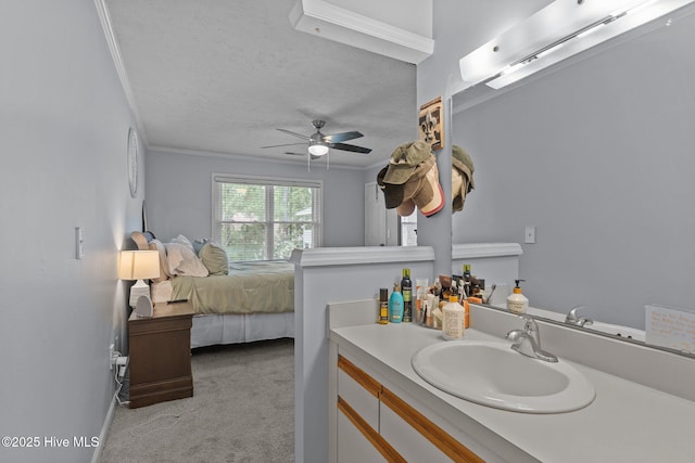 1825 Savannah Ct Unit D3, Wilmington, NC 28403 - bathroom featuring ornamental molding, ceiling fan, vanity, ensuite bath, and a textured ceiling