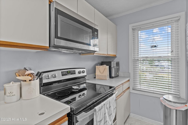 1825 Savannah Ct Unit D3, Wilmington, NC 28403 - kitchen with stainless steel appliances, light countertops, healthy amount of natural light, light marble finish flooring, and crown molding