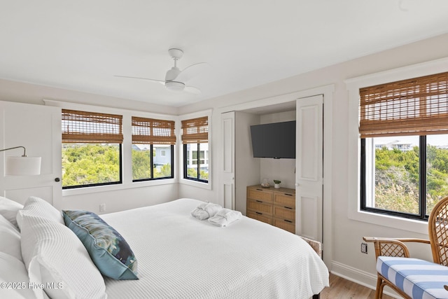 305 S Bald Head Wynd Wynd Unit 16, Bald Head Island, NC 28461 - bedroom featuring light wood-style floors, baseboards, and ceiling fan
