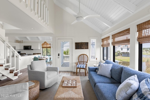 305 S Bald Head Wynd Wynd Unit 16, Bald Head Island, NC 28461 - living area with high vaulted ceiling, beam ceiling, light wood finished floors, ceiling fan, and stairway