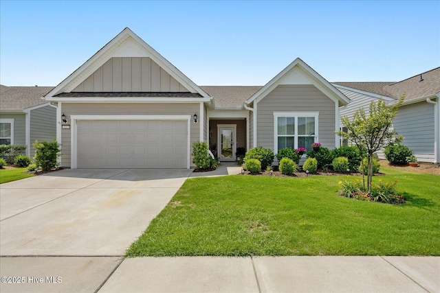 3213 Laughing Gull Ter, Wilmington, NC 28412 - view of front facade with board and batten siding, an attached garage, concrete driveway, a front lawn, and a shingled roof