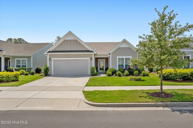 3213 Laughing Gull Ter, Wilmington, NC 28412 - view of front of house with board and batten siding, a garage, concrete driveway, a front lawn, and a shingled roof