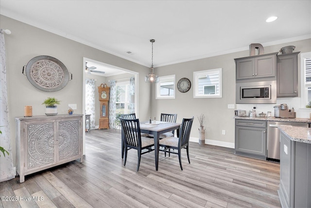 3213 Laughing Gull Ter, Wilmington, NC 28412 - dining area featuring light wood-style floors, baseboards, crown molding, and recessed lighting