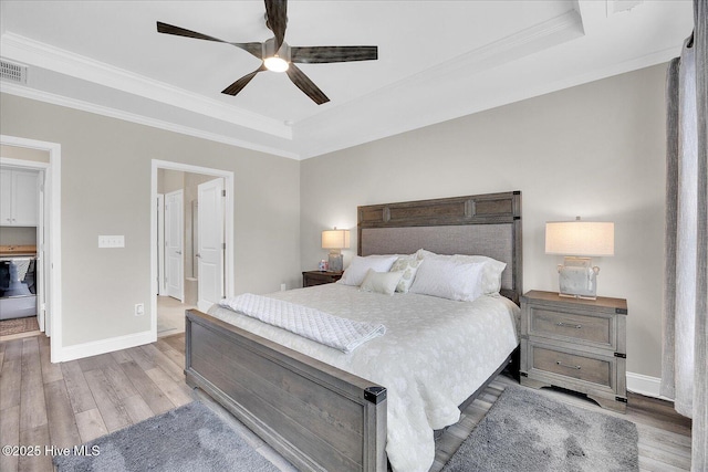 3213 Laughing Gull Ter, Wilmington, NC 28412 - bedroom with ornamental molding, a raised ceiling, wood finished floors, baseboards, and a ceiling fan