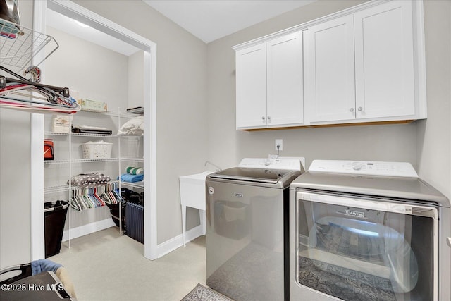 3213 Laughing Gull Ter, Wilmington, NC 28412 - laundry area with cabinet space, washer and clothes dryer, and baseboards
