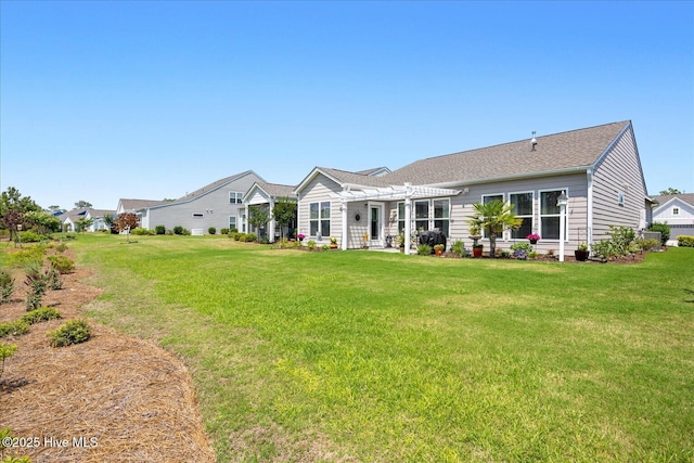 3213 Laughing Gull Ter, Wilmington, NC 28412 - rear view of house featuring a pergola, a lawn, roof with shingles, and a patio