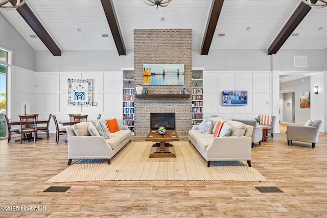 3213 Laughing Gull Ter, Wilmington, NC 28412 - living area featuring wood finished floors and a brick fireplace
