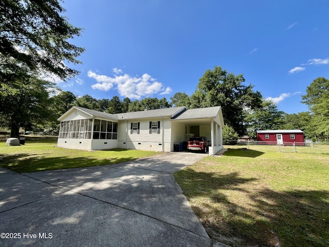 22541 Henry St, Laurel Hill, NC 28351 - view of front facade with crawl space, concrete driveway, a sunroom, and a carport