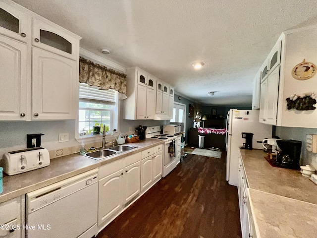 22541 Henry St, Laurel Hill, NC 28351 - kitchen featuring white appliances, a sink, white cabinetry, dark wood-type flooring, and a textured ceiling